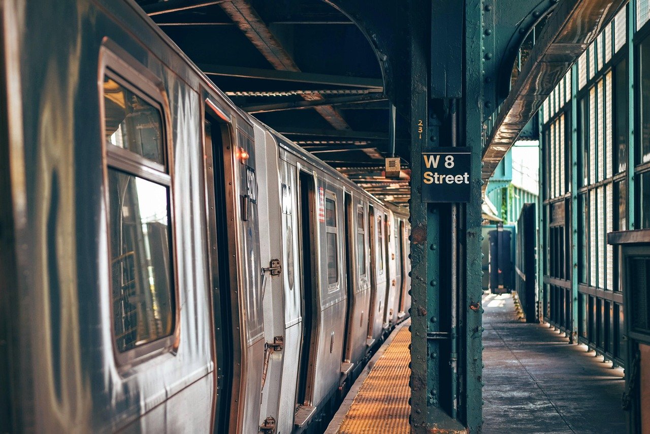 Interactive digital wayfinding kiosk in a train station displaying coin locker and amenity maps.